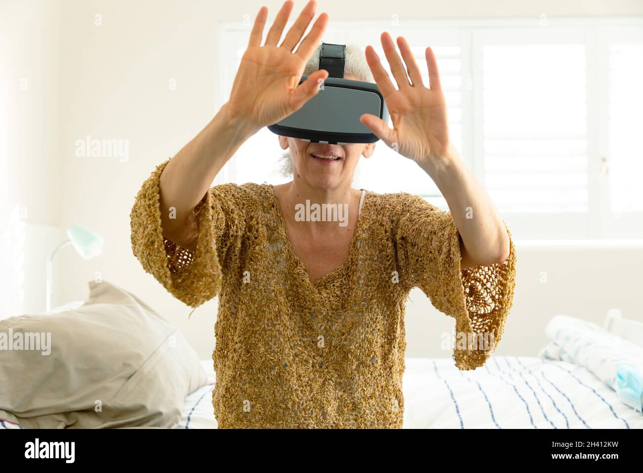 Happy senior caucasian woman wearing vr headset and having fun Stock ...