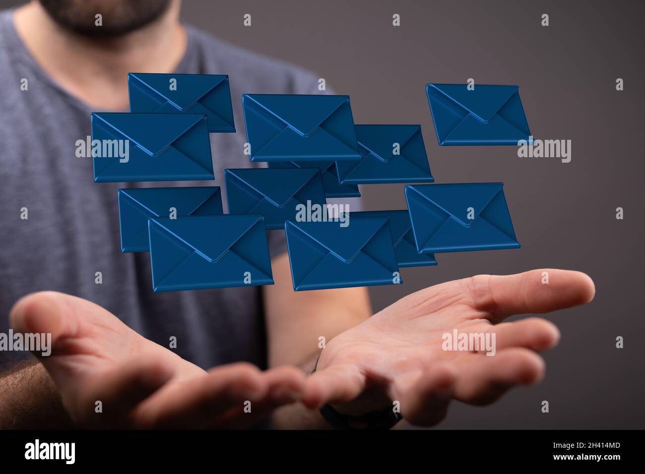 A 3D rendering of email inbox icons floating on a businessman's hand ...