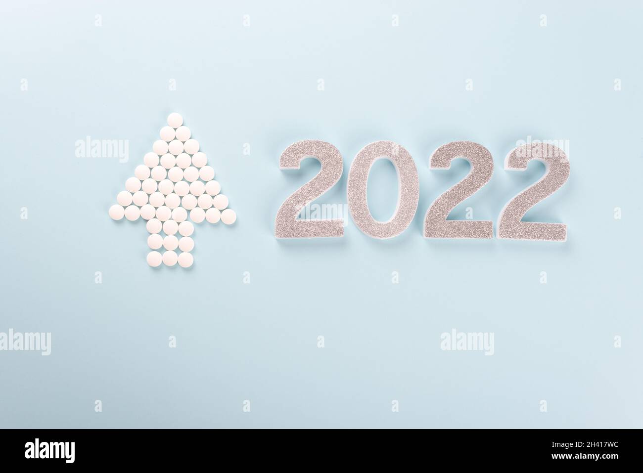 Christmas 2022 Tablets Silver Colour 2022 And Christmas Tree Made From Medication Pills, Tablets  Stock Photo - Alamy
