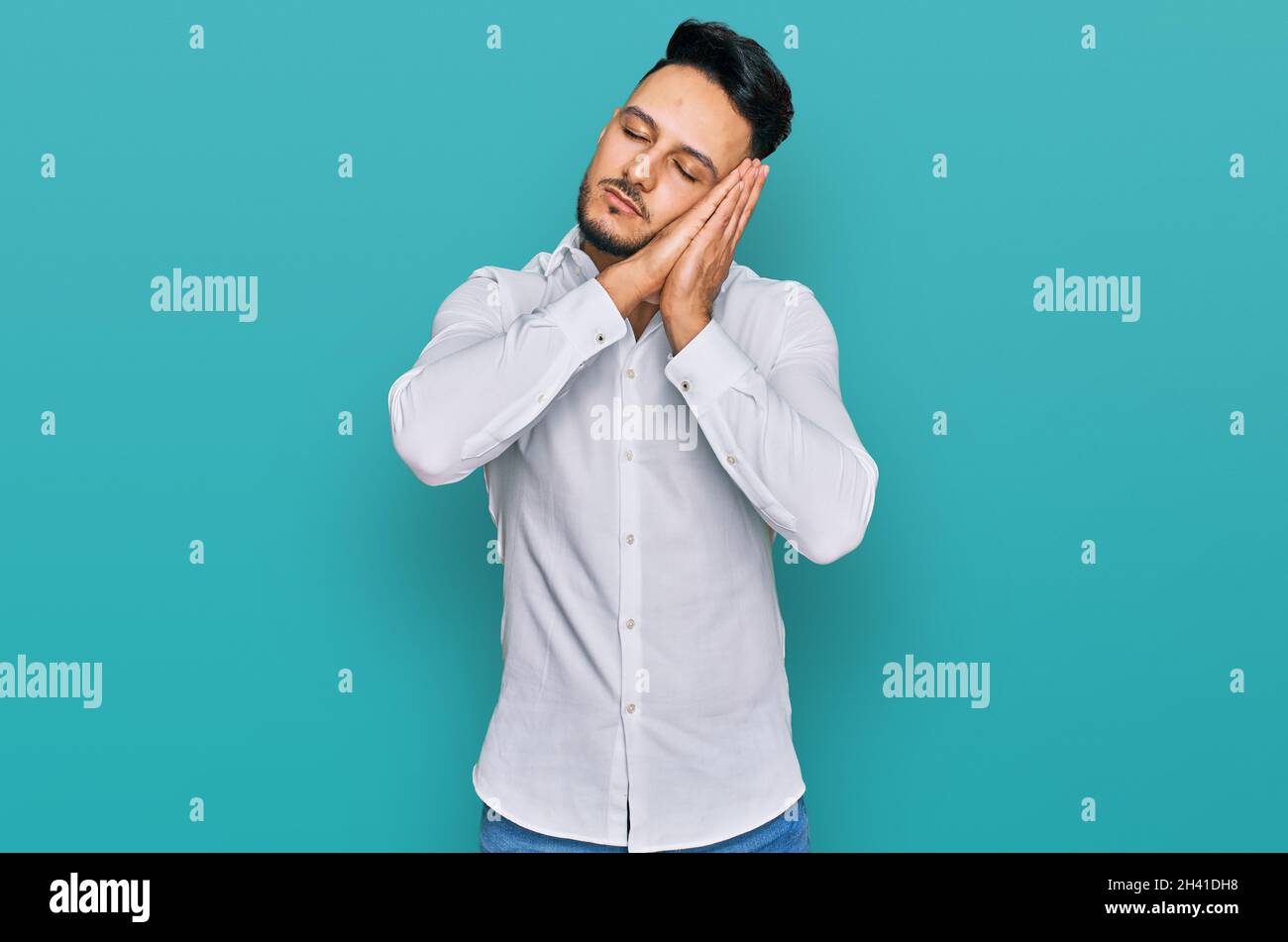 Young arab man wearing casual clothes sleeping tired dreaming and ...