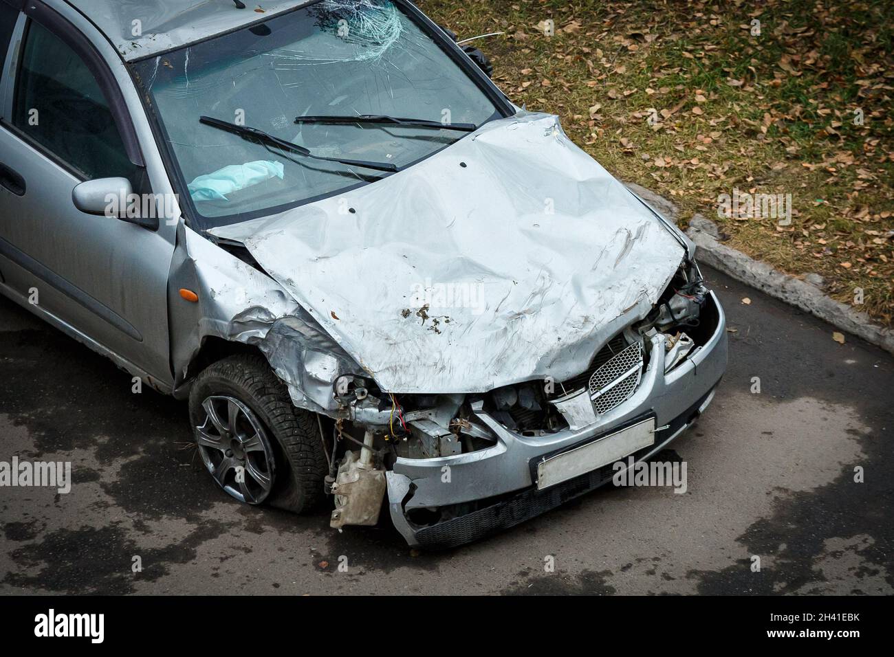 A wrecked car after an accident in the parking lot Stock Photo - Alamy