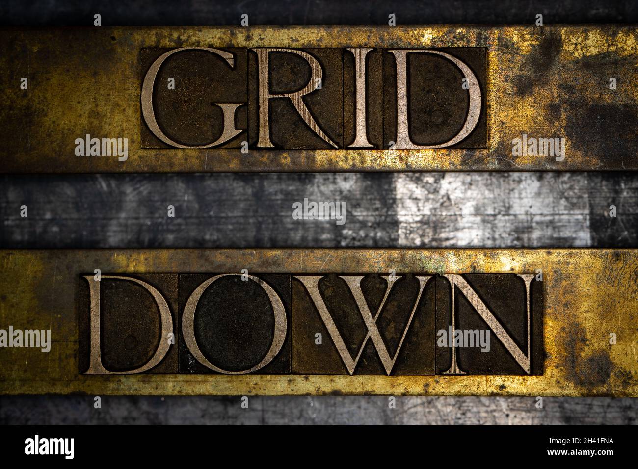 Grid Down text on vintage textured grunge copper and gold background Stock Photo