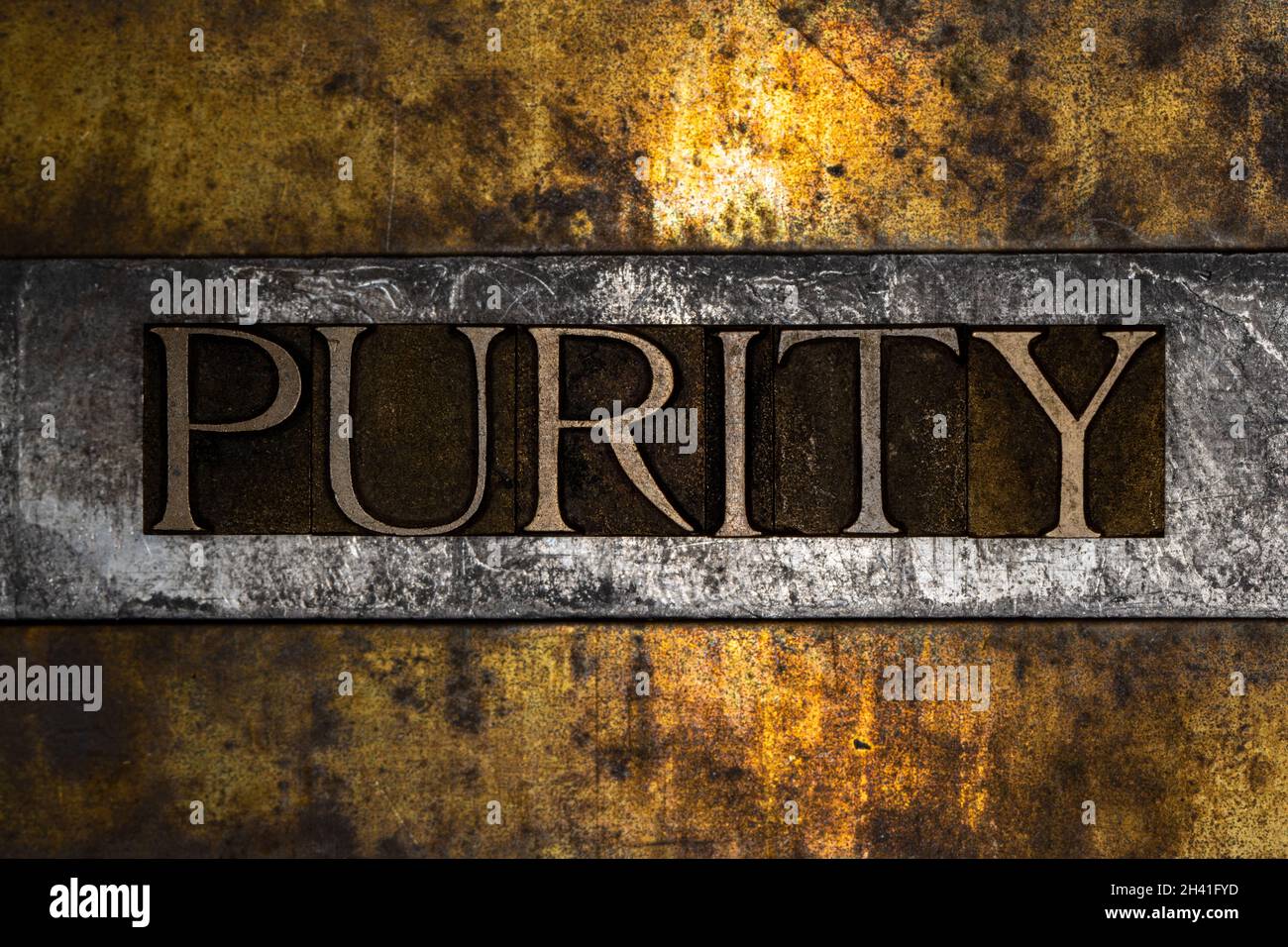 Purity text message on textured grunge copper and vintage gold background Stock Photo