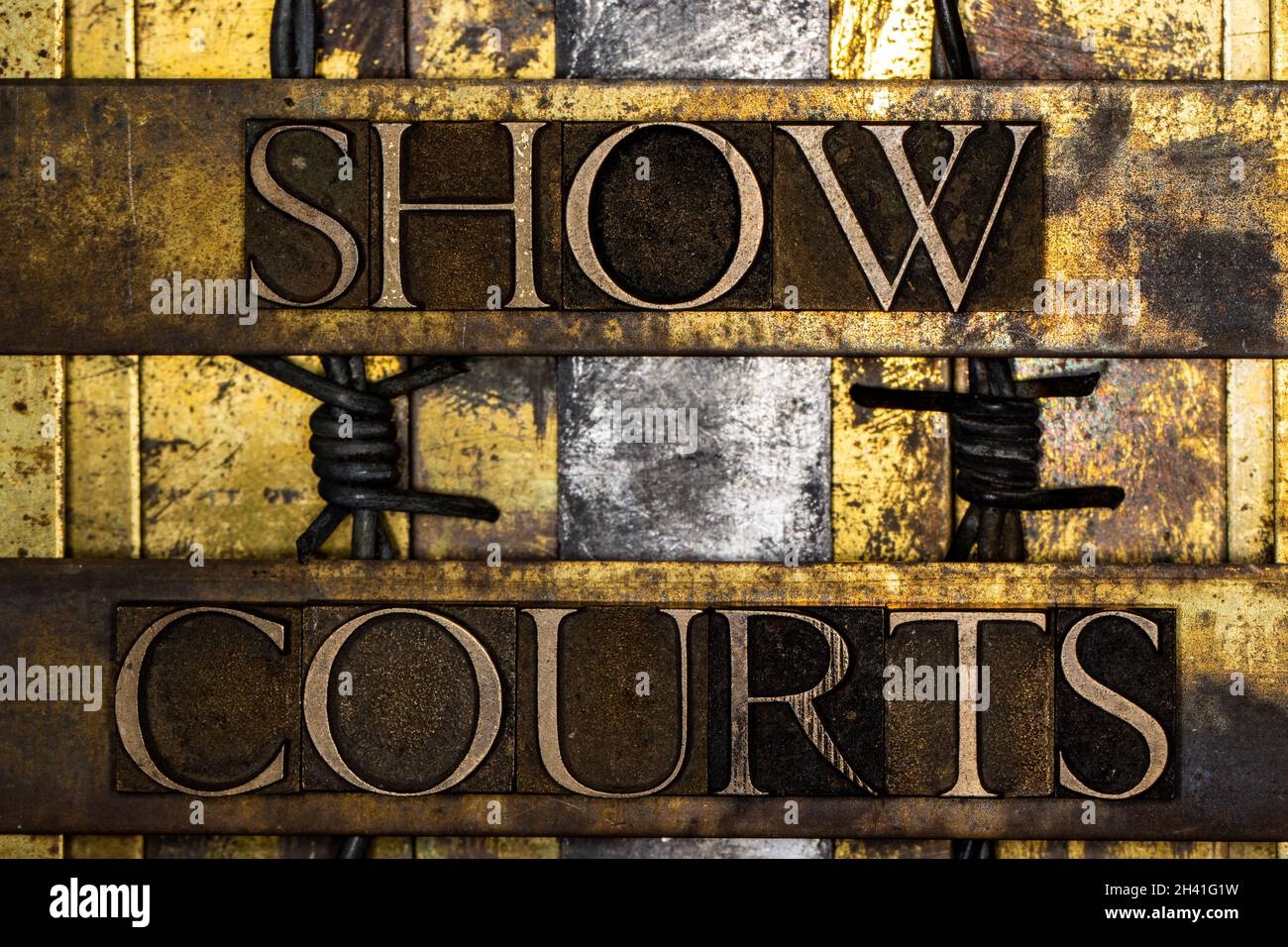 Show Courts text on textured grunge copper and vintage gold background Stock Photo