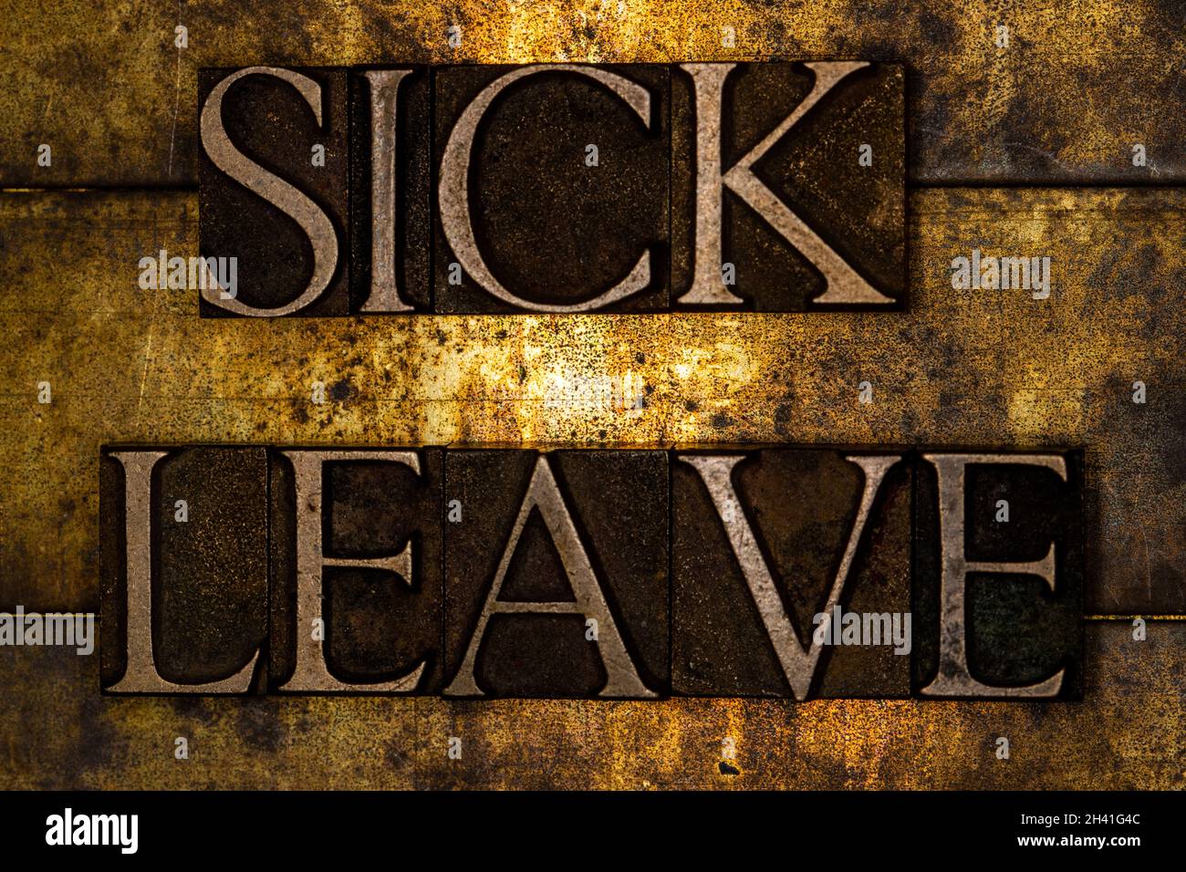 Sick Leave text on textured grunge copper and vintage gold background Stock Photo