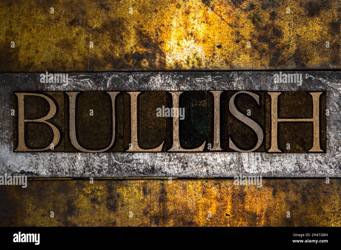 Bullish text on grunge textured gold and copper background Stock Photo