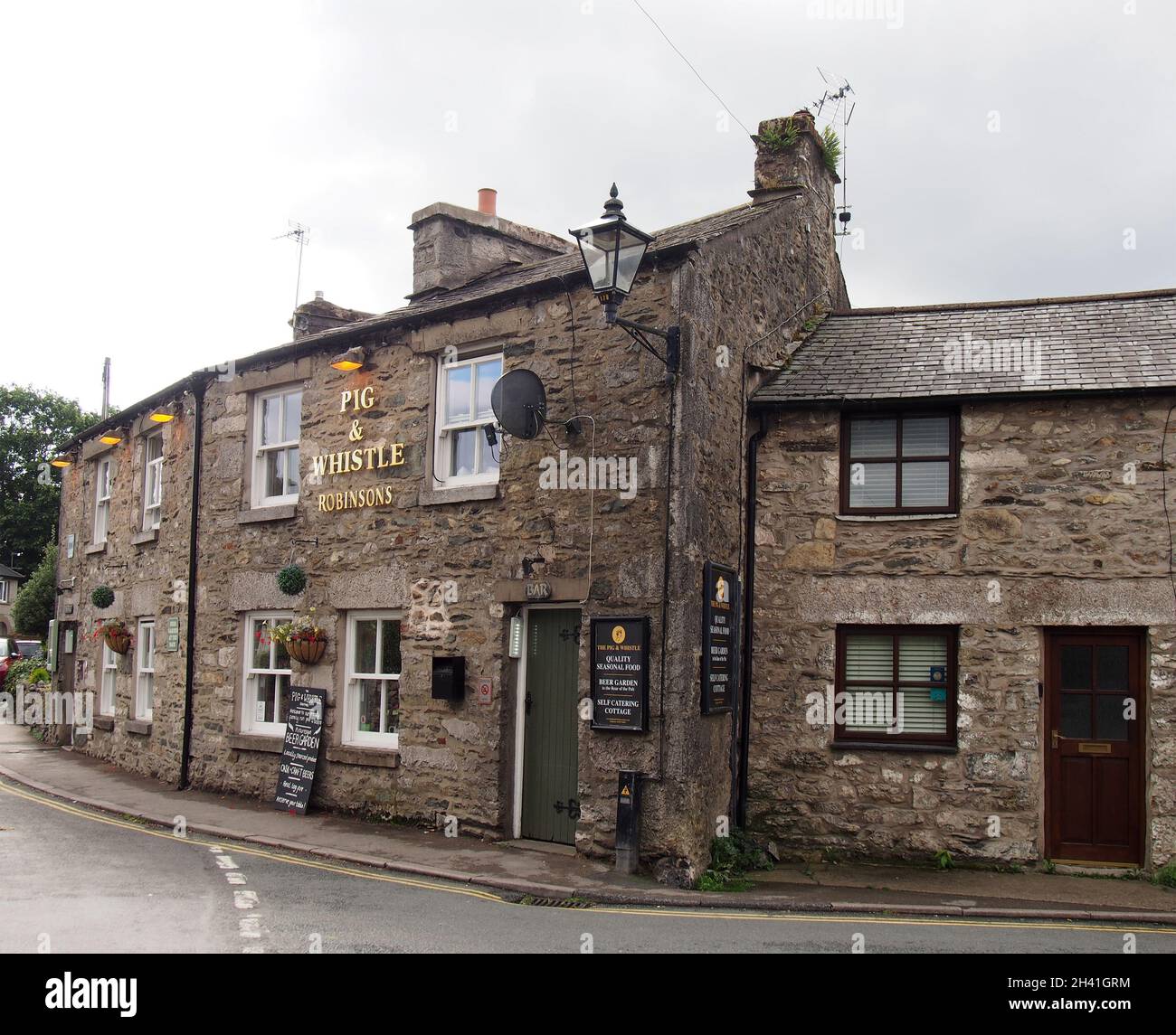 The pig and whistle pub in carmel cumbria Stock Photo Alamy