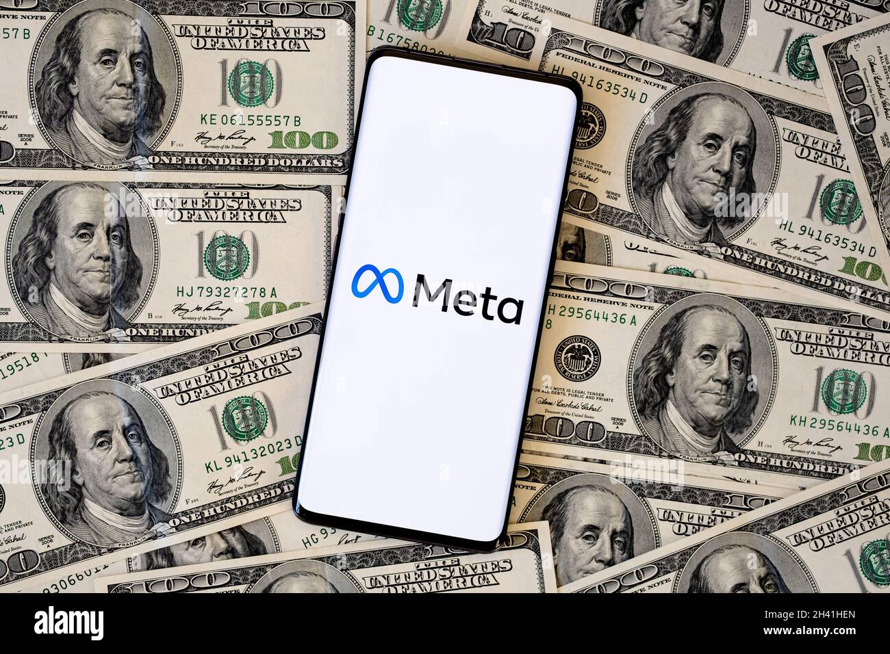 FACEBOOK META company logo seen smartphone which is placed on US dollar bills. Selective focus. Concept. Stafford, United Kingdom, October 28, 2021. Stock Photo