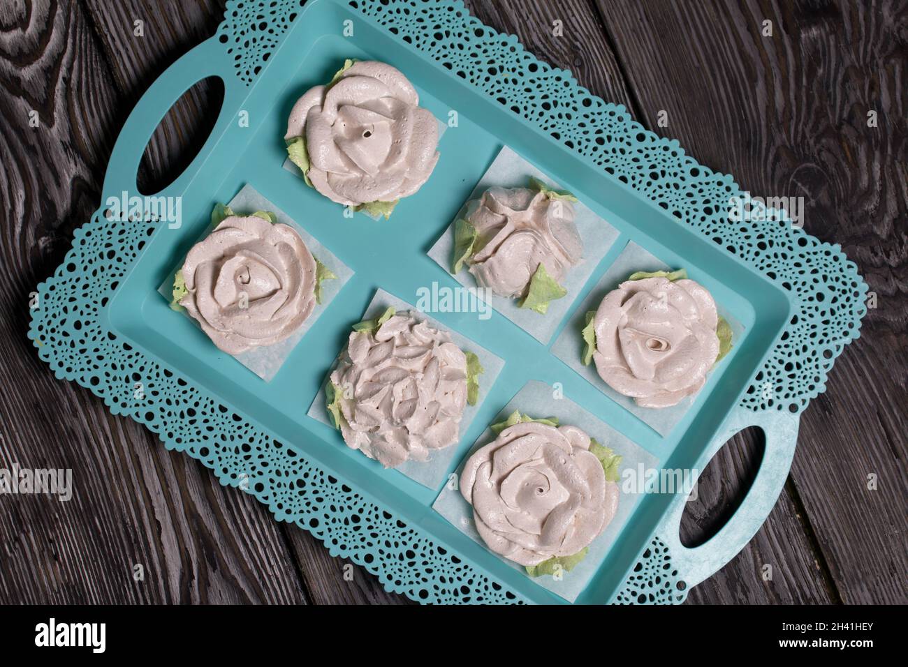 Homemade marshmallow. Zephyr roses. Marshmallow roses. Lies on a tray ...