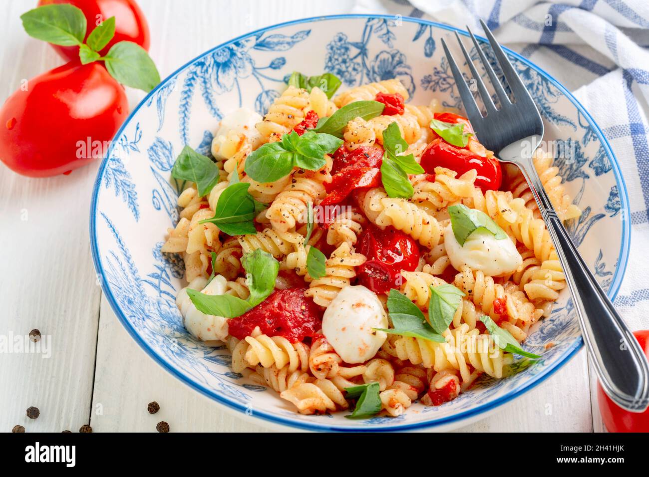 Pasta with baked caprese. Stock Photo