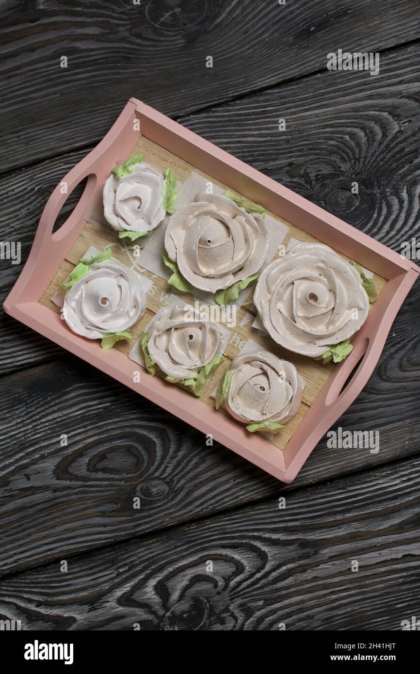 Homemade marshmallow. Zephyr roses. Marshmallow roses. Lies on a tray ...