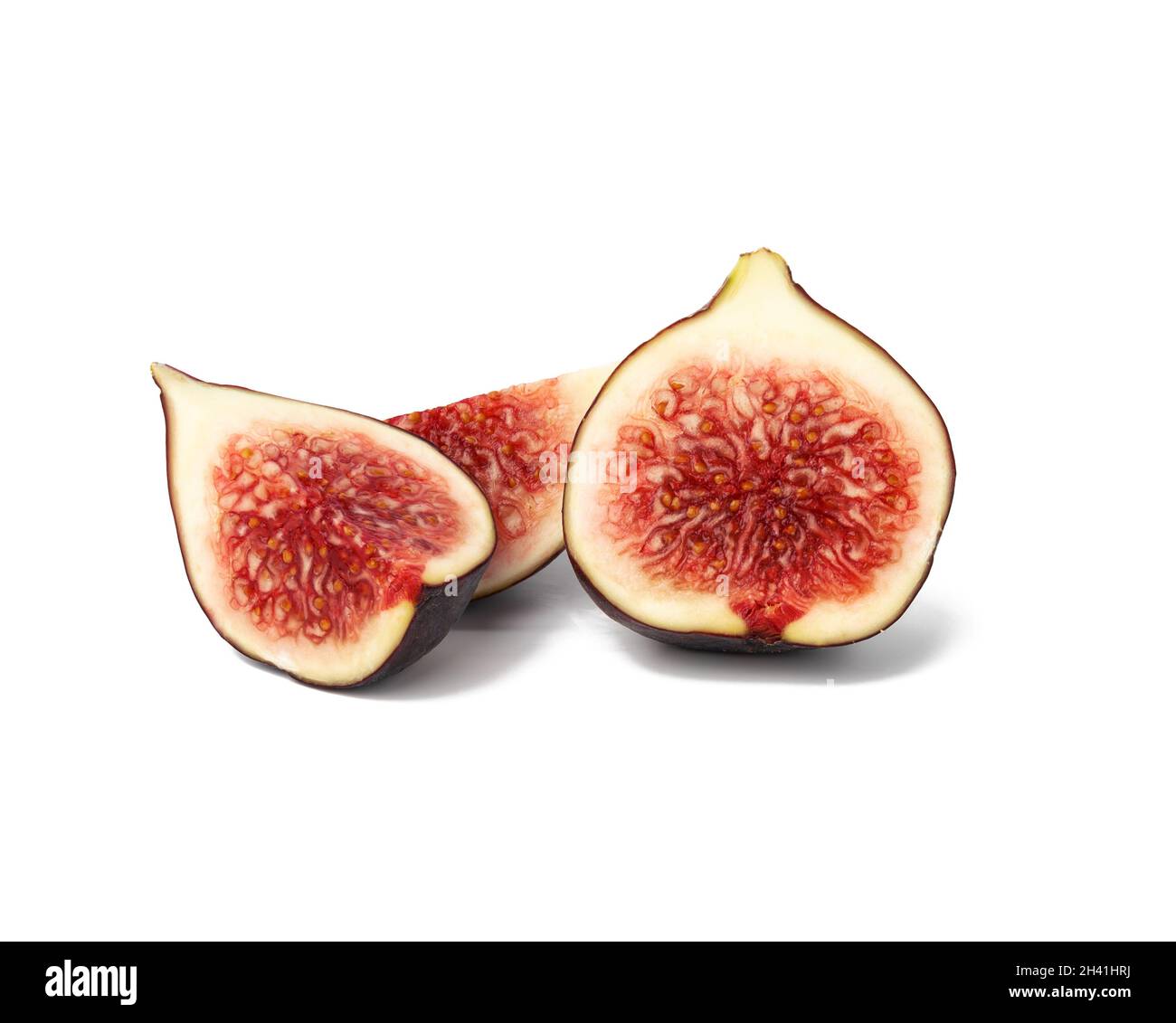 Whole fruit and fig slices on white background Stock Photo