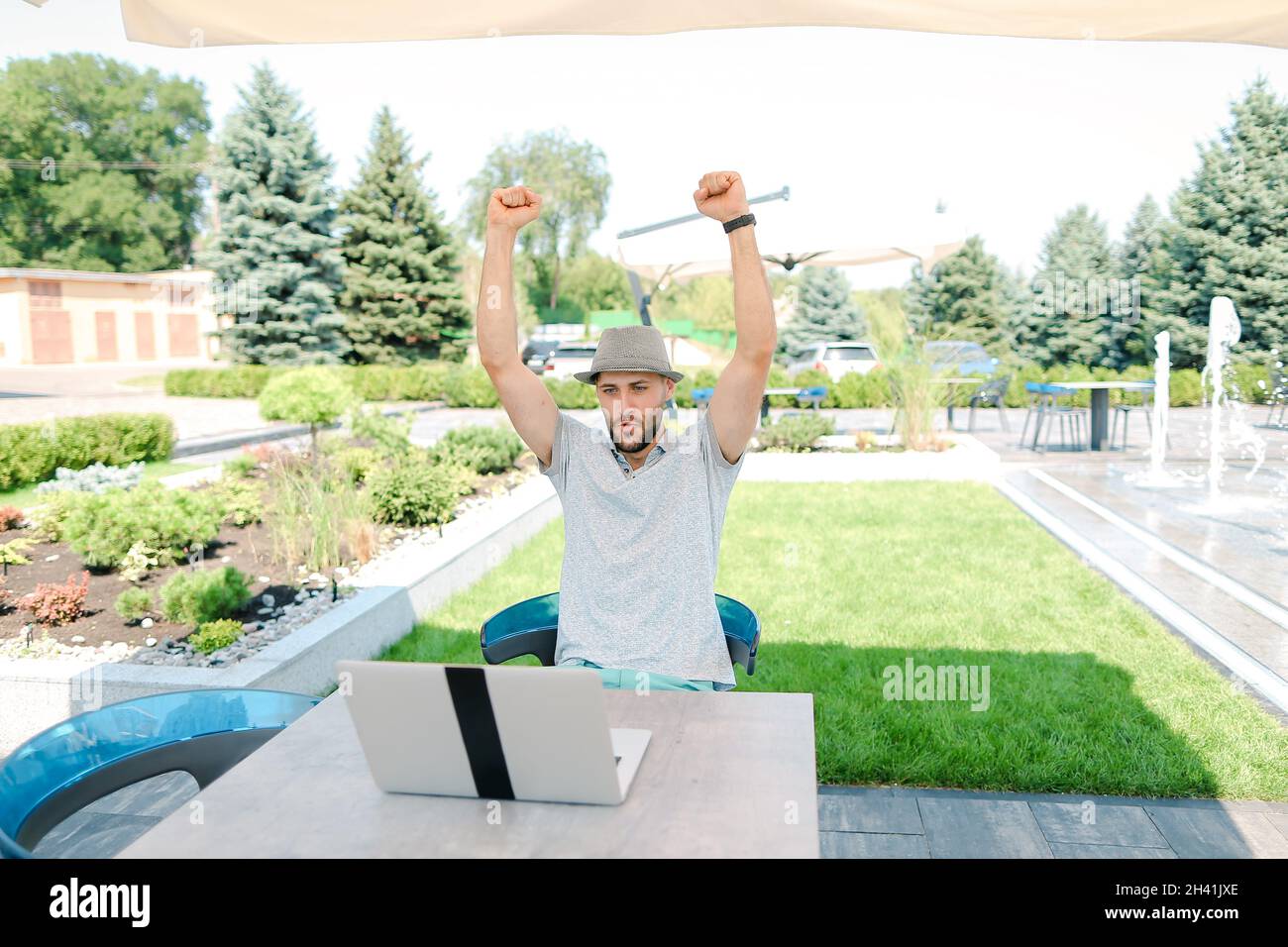 Jocund fun sitting in bag chair and supporting favorite sport squad in live  stream with laptop Stock Photo - Alamy