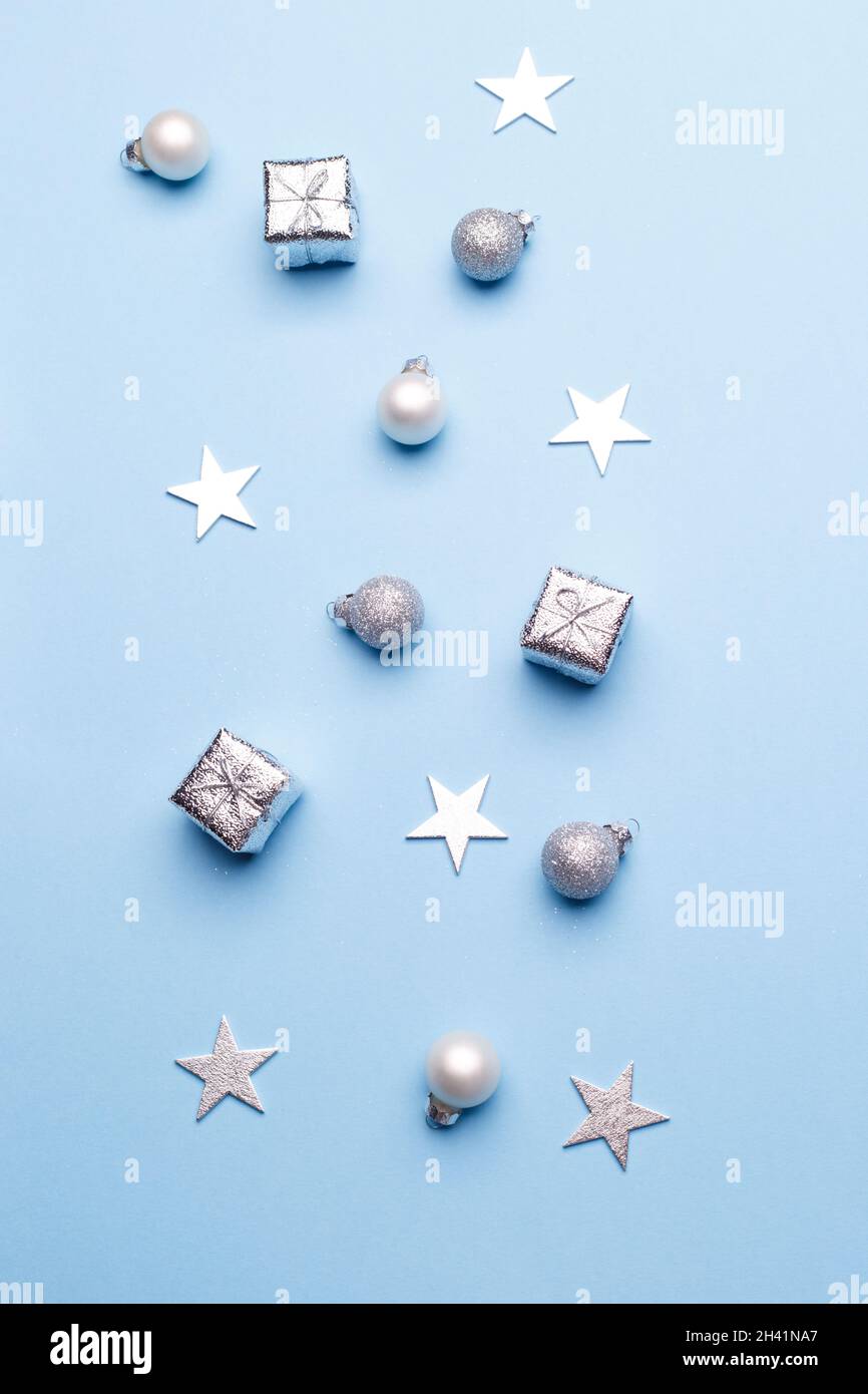 Christmas silver decorations on blue background Stock Photo