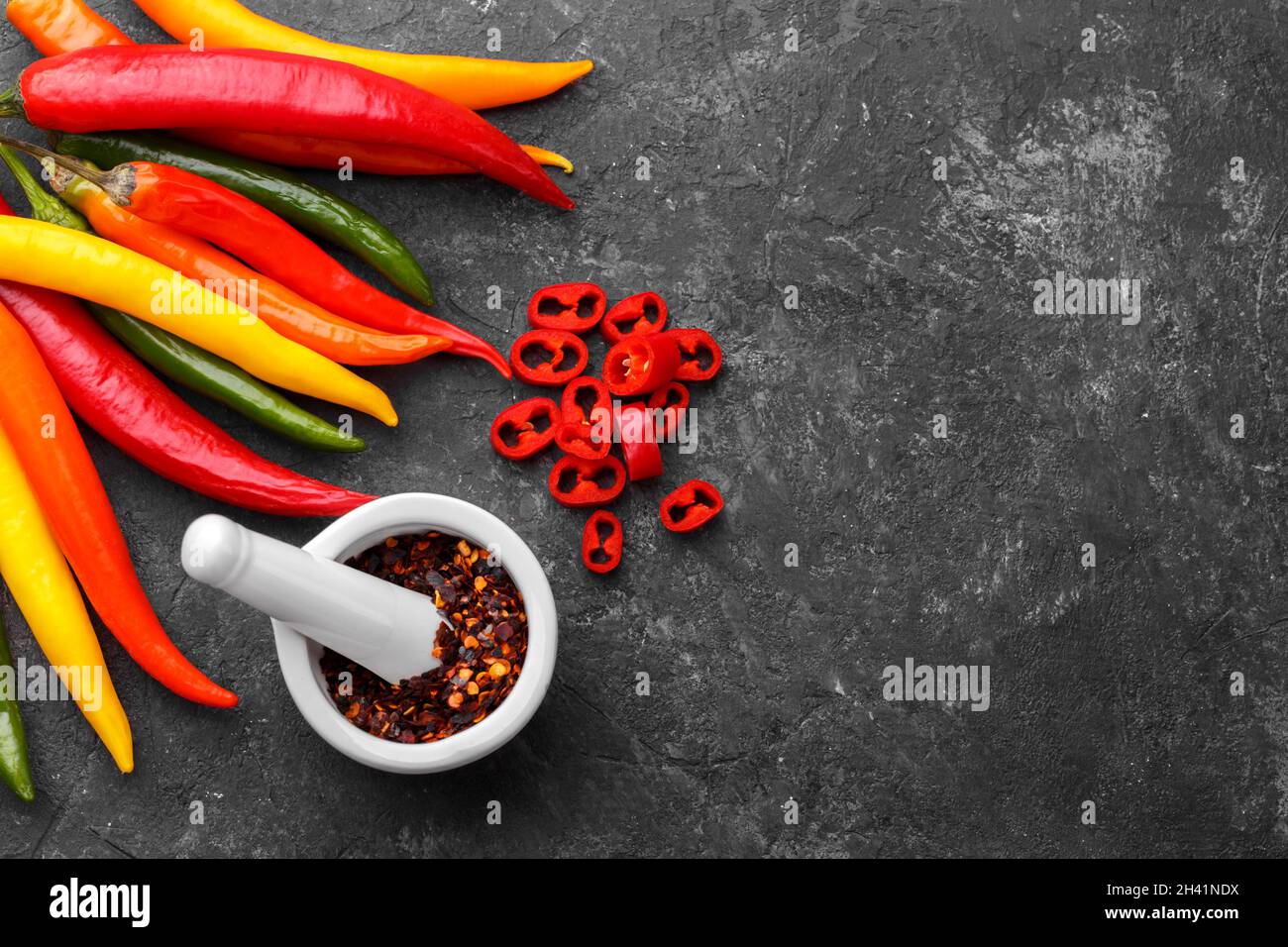 Red, yellow and green chili peppers Stock Photo