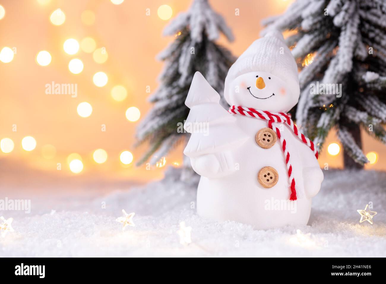 Snowman toy on the snow Stock Photo