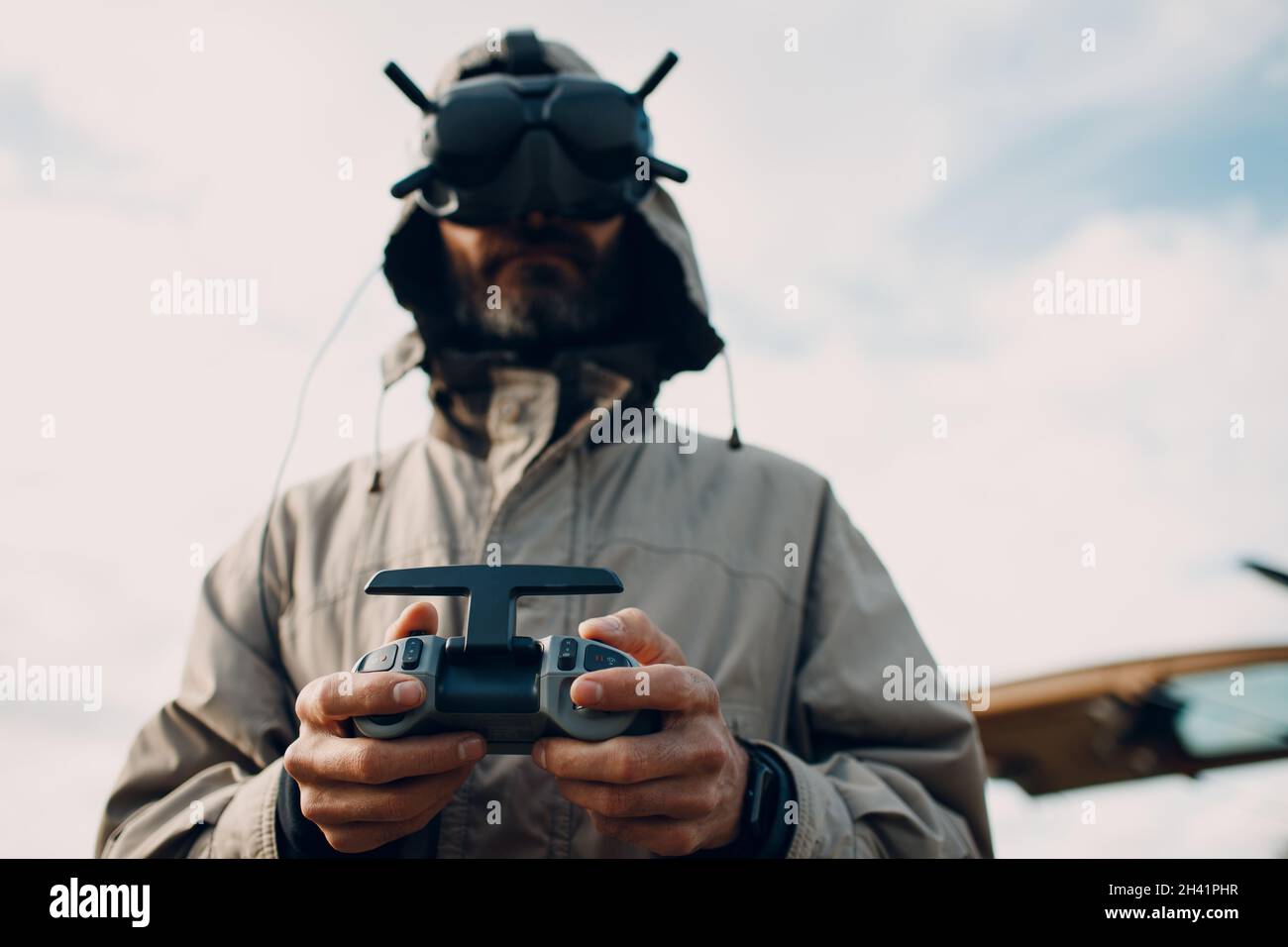 Man controlling fpv quadcopter drone with goggles antenna remote controller  Stock Photo - Alamy