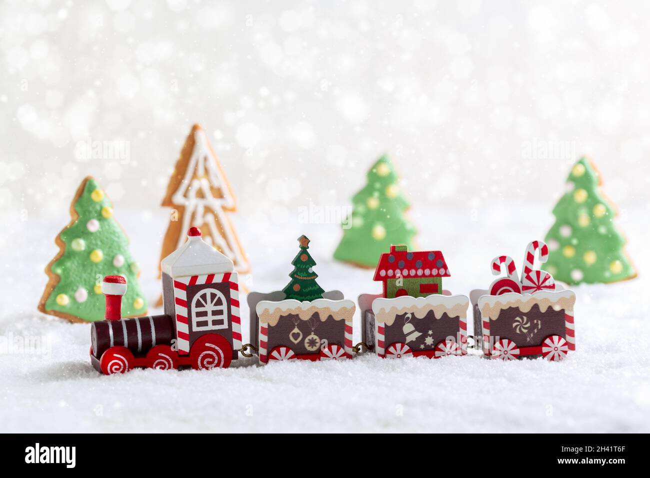 Christmas toy train with a Christmas tree and gifts. Stock Photo