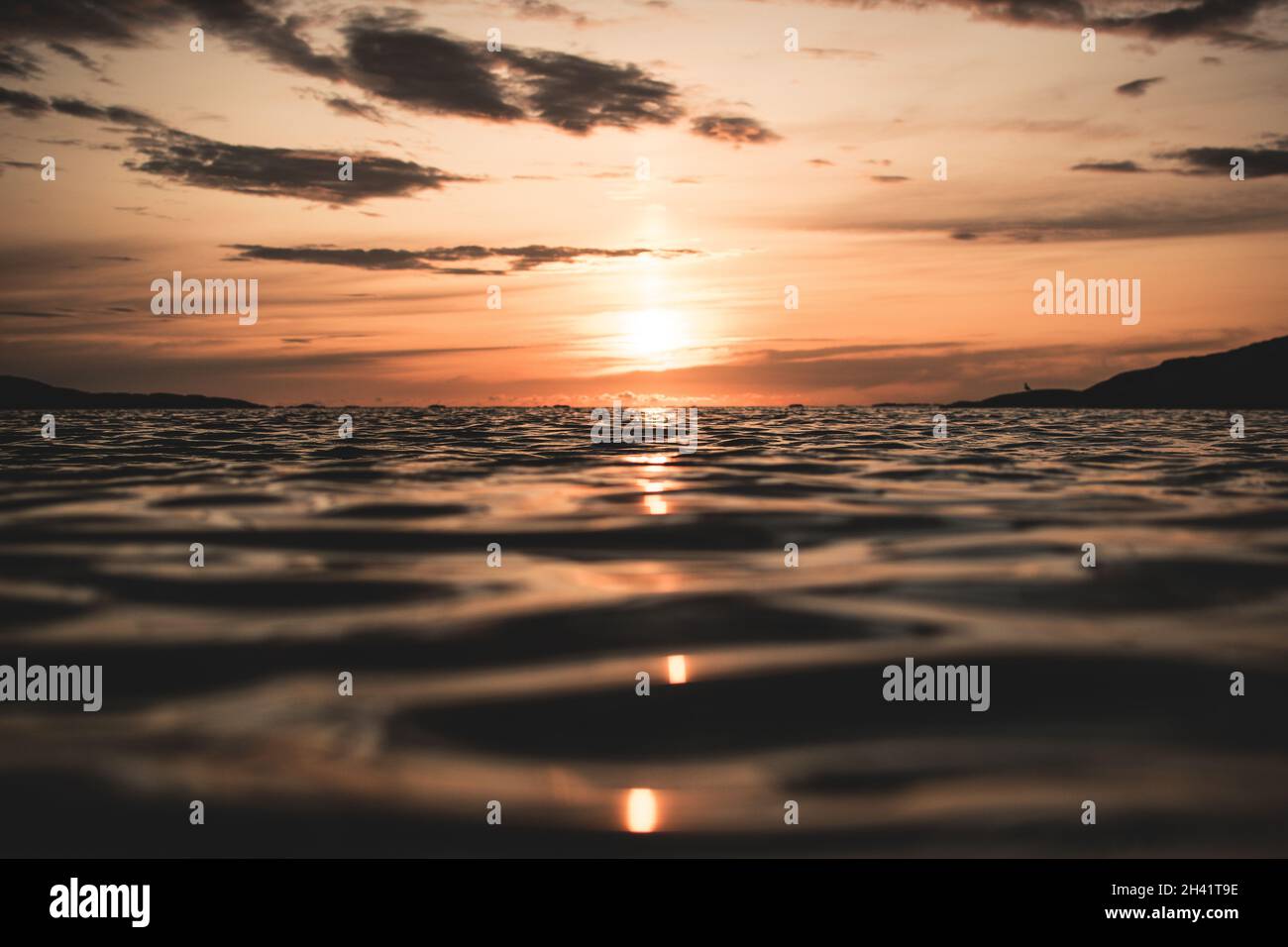 A Beautiful scene of a sunset from the sea Stock Photo - Alamy