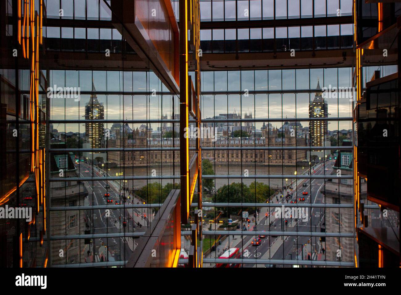 A reflection of Big Ben, the Houses of Paliament and traffic going over Westminster Bridge from an unusual angle Stock Photo