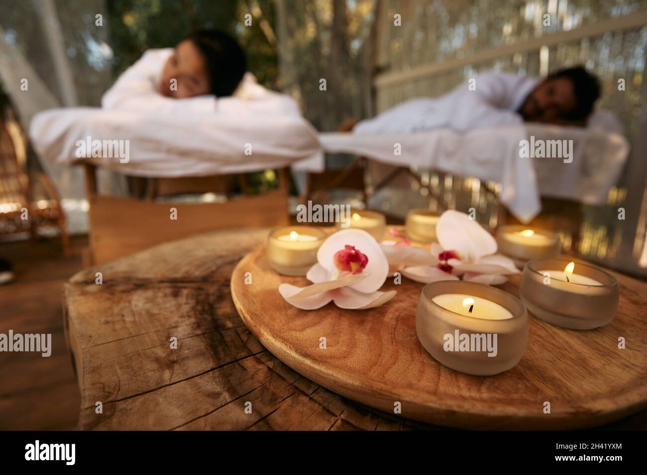 Aroma massage for couple at spa resort. Couple lying on massage tables