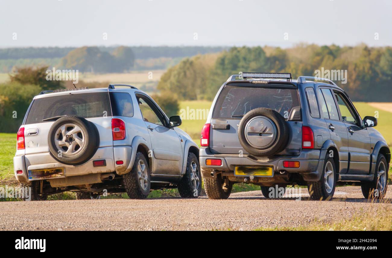 Toyota RAV4 and Suzuki Grand Vitara off-road driving across Salisbury Plain, Wiltshire UK Stock Photo