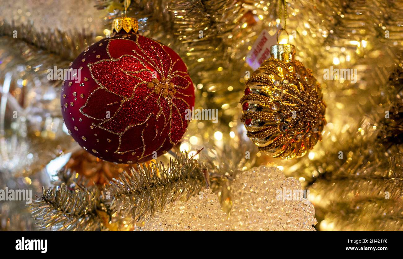 Decorated christmas tree with red ball on blurred gold glittering and ...