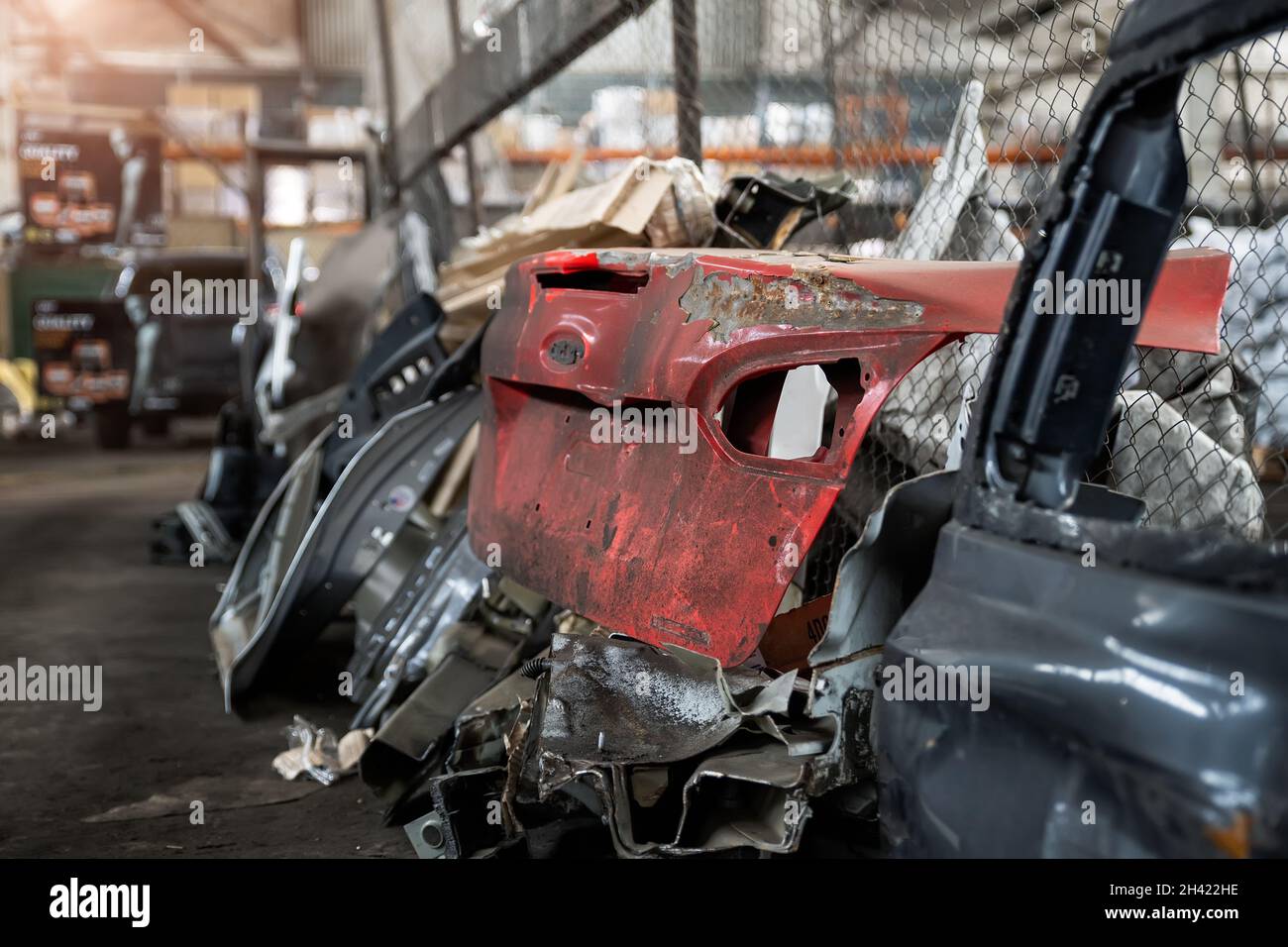 Heap of old rusty disassembled car parts at waste storage
