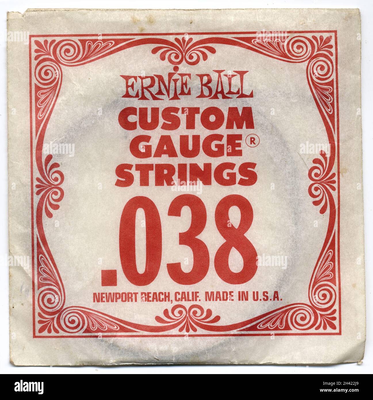 A packet of Ernie Ball custom gauge guitar strings from USA.  Famous Ernie Ball logo on packet.  Rock and roll memorabilia. Stock Photo