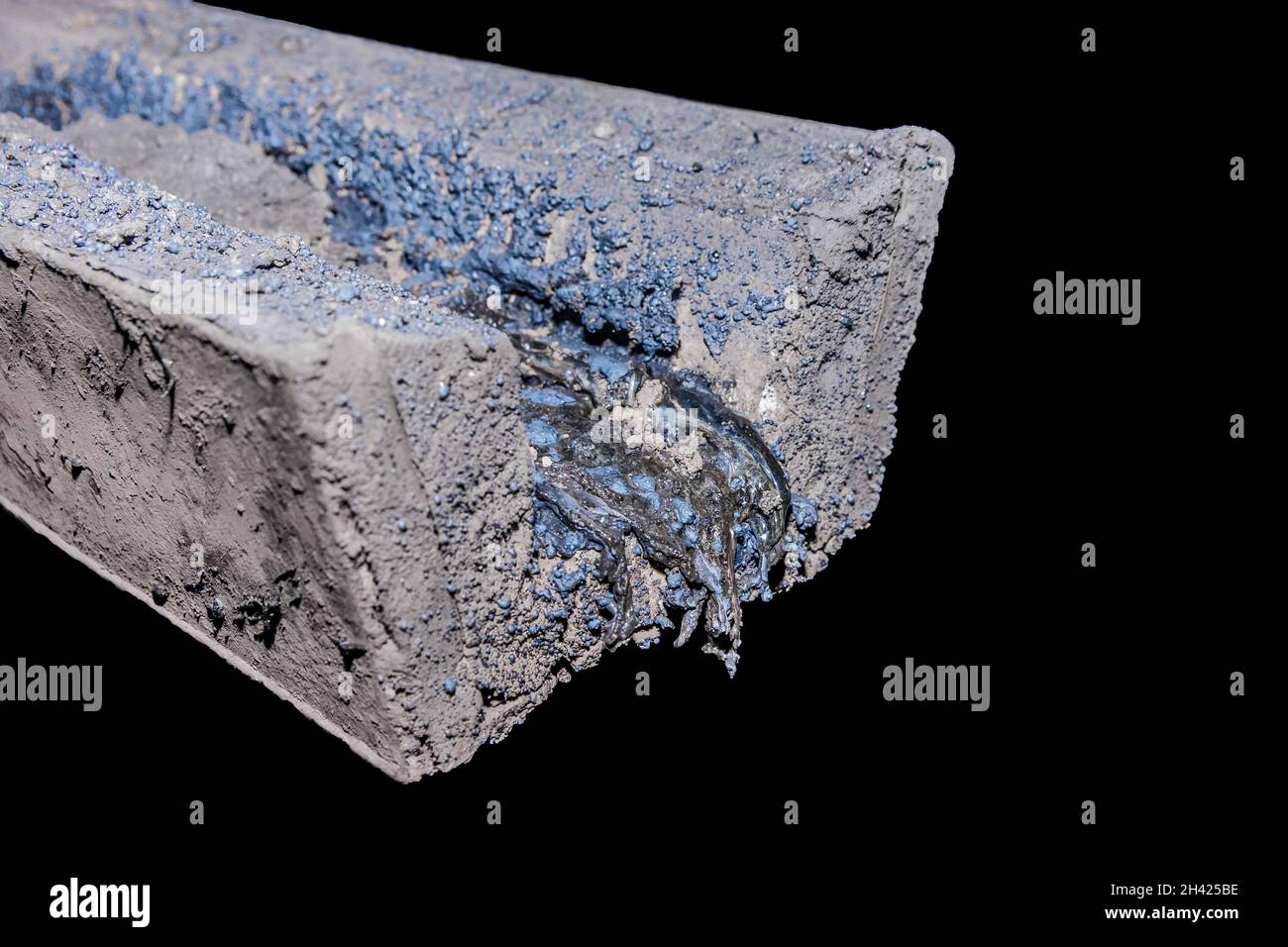 Residues of frozen metal after smelting and casting. Hardened steel