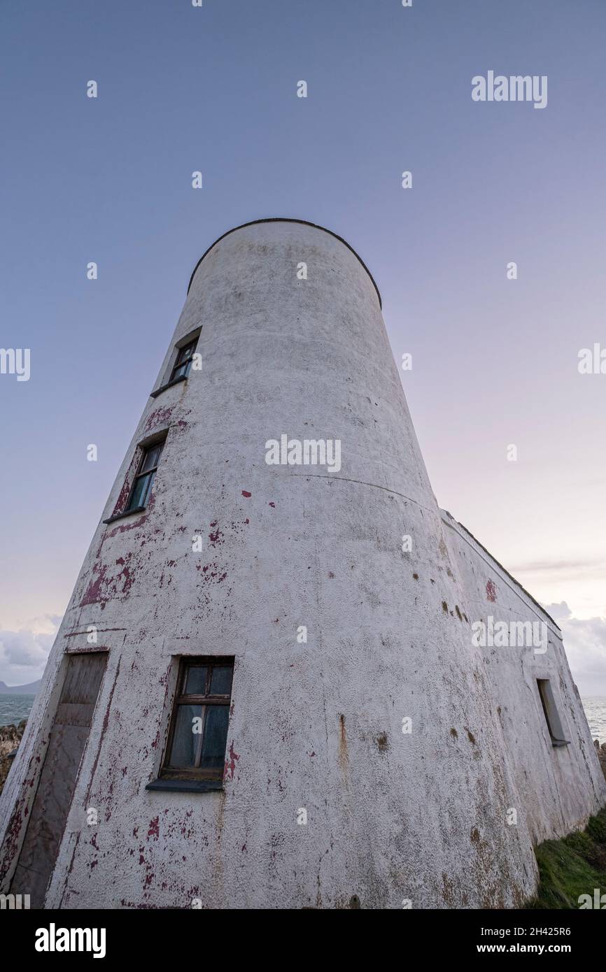 A low angle view of the lighthouse at Ynys Llanddwyn on Anglesey in  North Wales, UK Stock Photo