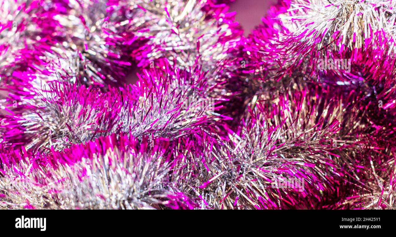 Pink Christmas tree tinsel. Christmas and New Year . Decoration for the holiday Stock Photo Alamy