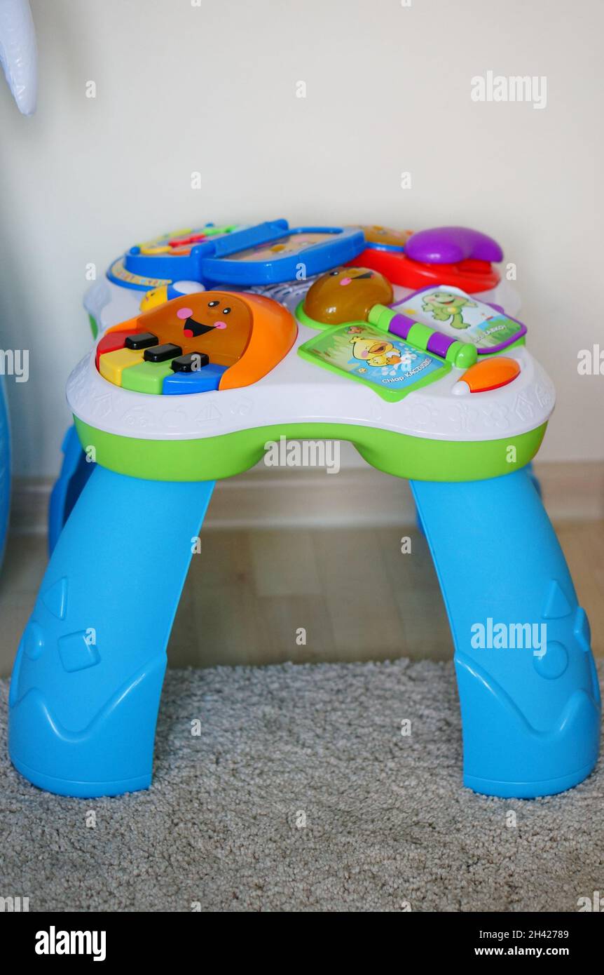 POZNAN, POLAND - May 03, 2015: A vertical shot of a Fisher-Price education  toy table with different buttons Stock Photo - Alamy