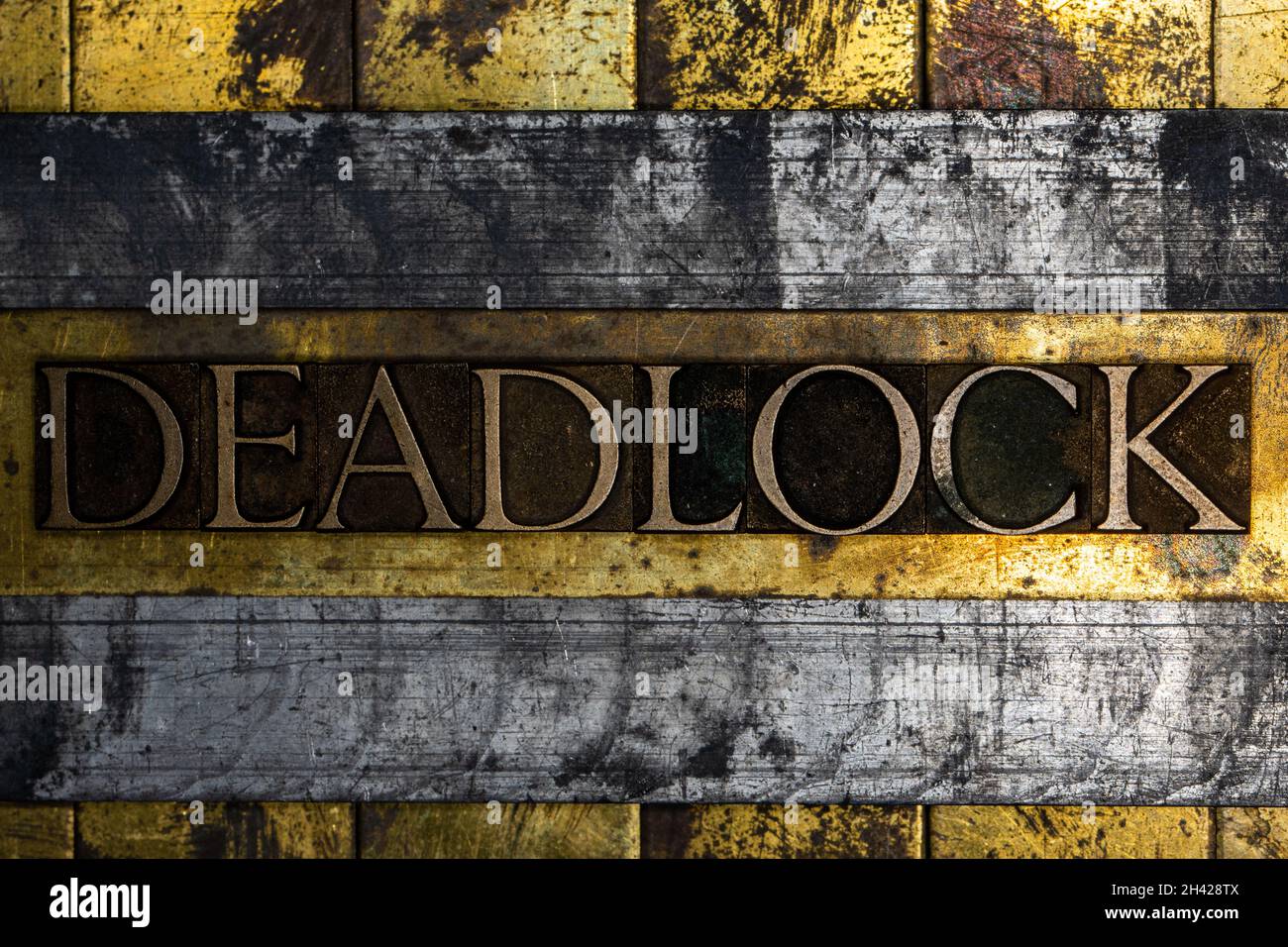 Deadlock text on textured grunge copper and vintage gold background Stock Photo