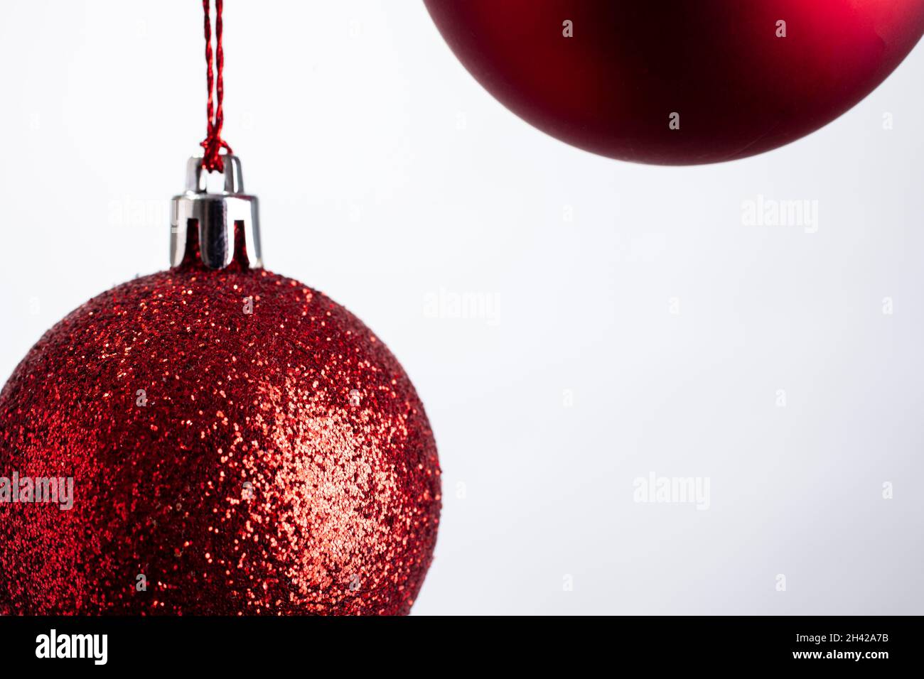 Red christmas ball on white background Stock Photo - Alamy