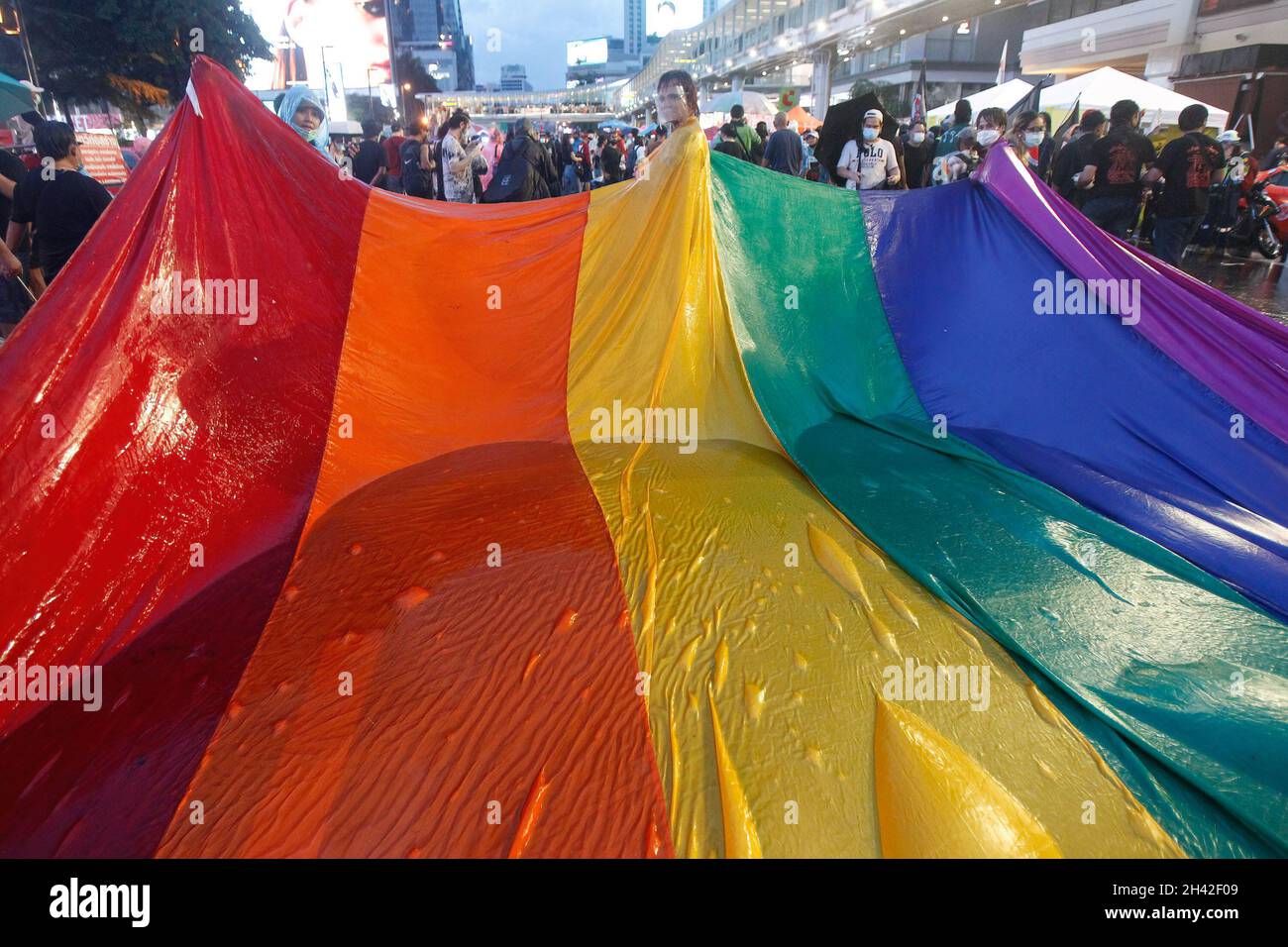 Bangkok, Thailand. 31st Oct, 2021. Thai LGBT pro-democracy protesters carry a rainbow flag during the demonstration. Anti-government protesters gathered at Ratchaprasong intersection in Bangkok demanding Prime Minister Prayuth Chan-ocha's resignation and the abolition of the 112 Lese-Majeste law. Credit: SOPA Images Limited/Alamy Live News Stock Photo