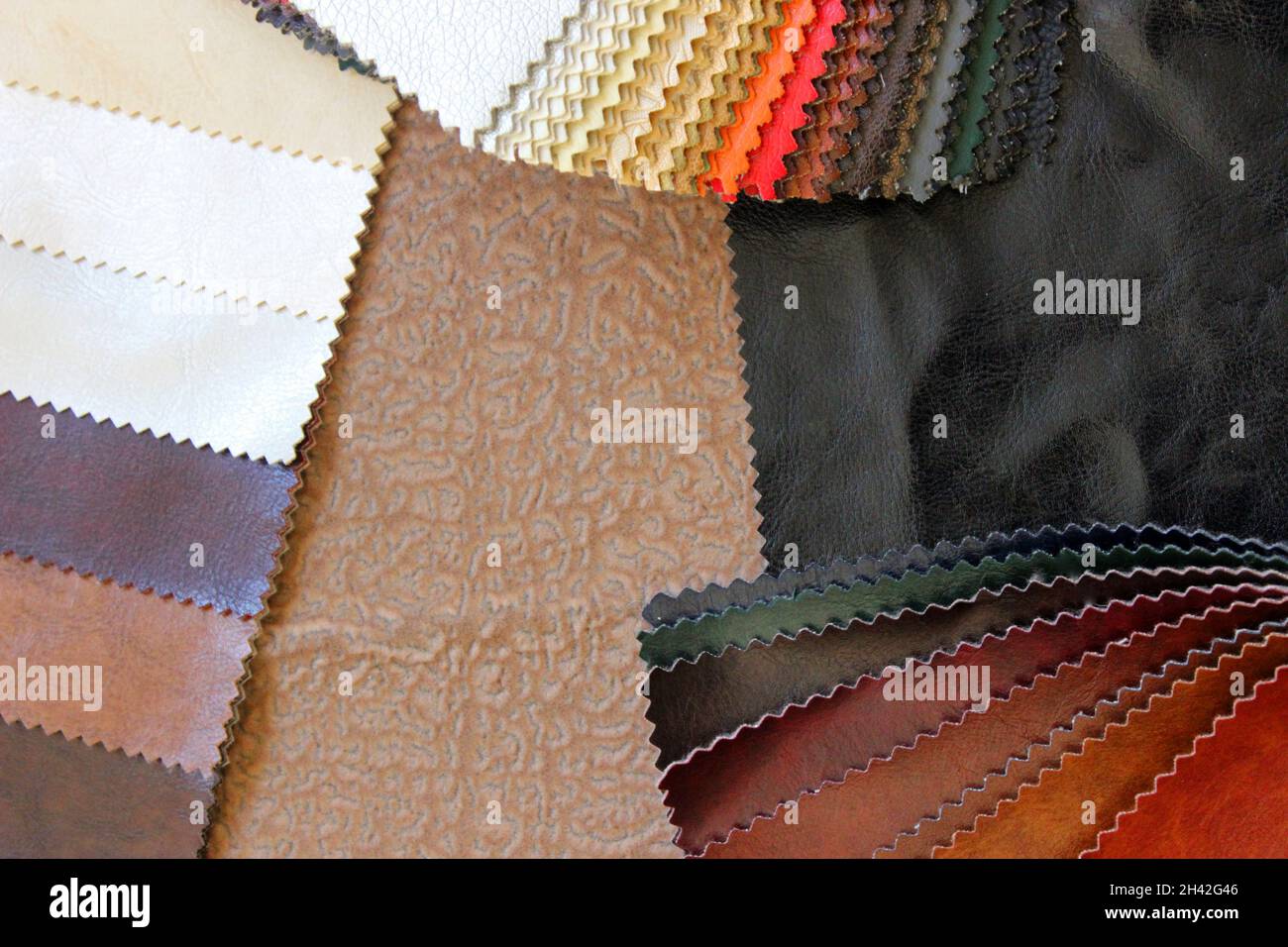 Samples of colorful upholstery fabrics. Various texture and colors. Stock Photo
