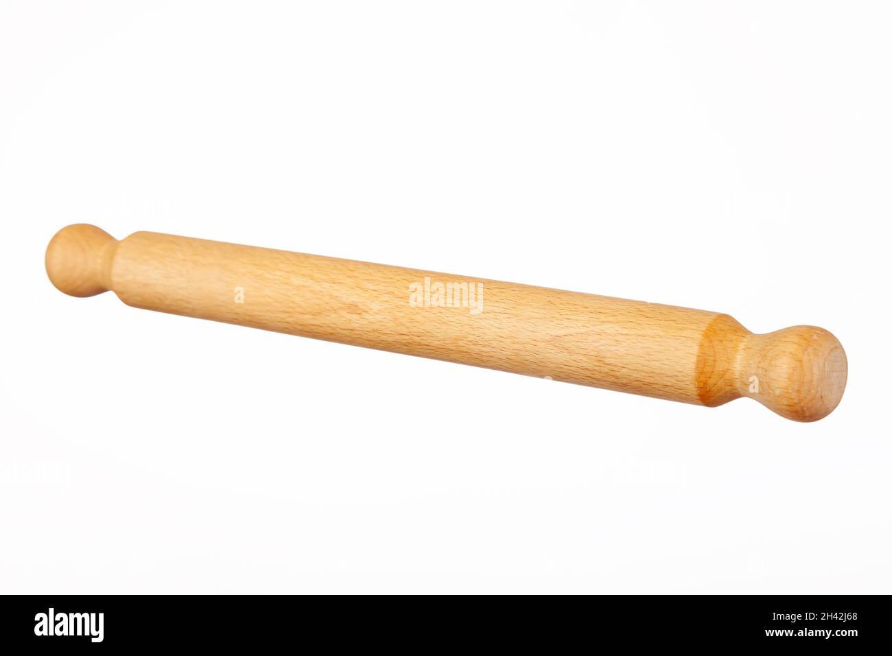 A wooden rolling pin on a white background Stock Photo
