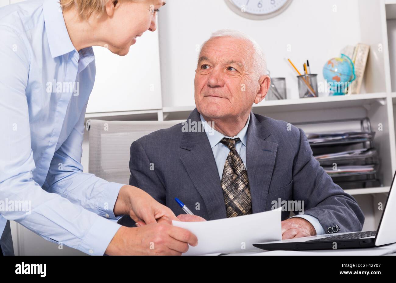 Manager and secretary working Stock Photo - Alamy