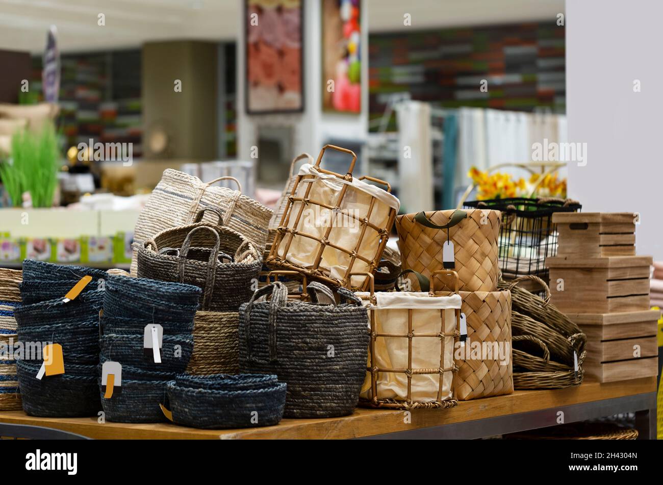 Laundry basket. Woven straw basket, container and boxes on a shelf in