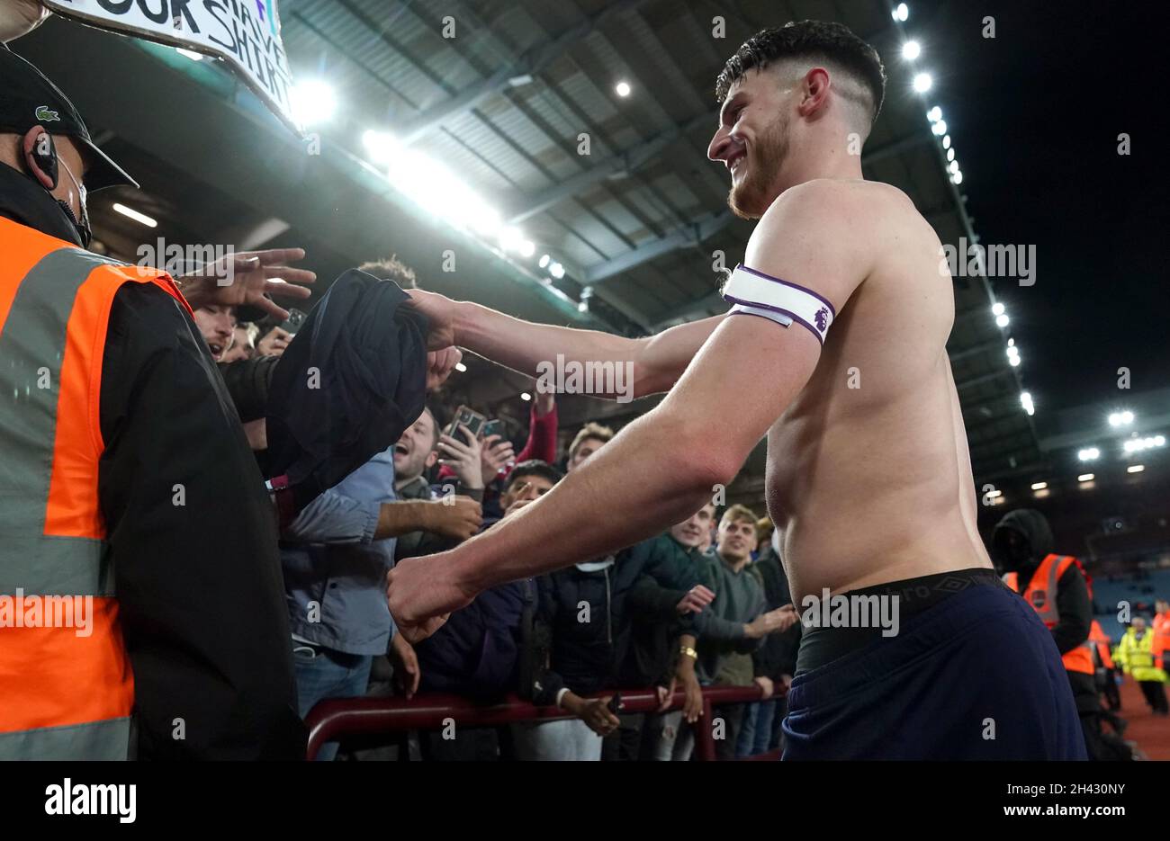 West Ham United's Declan Rice gives his shirt to a fan after the final ...