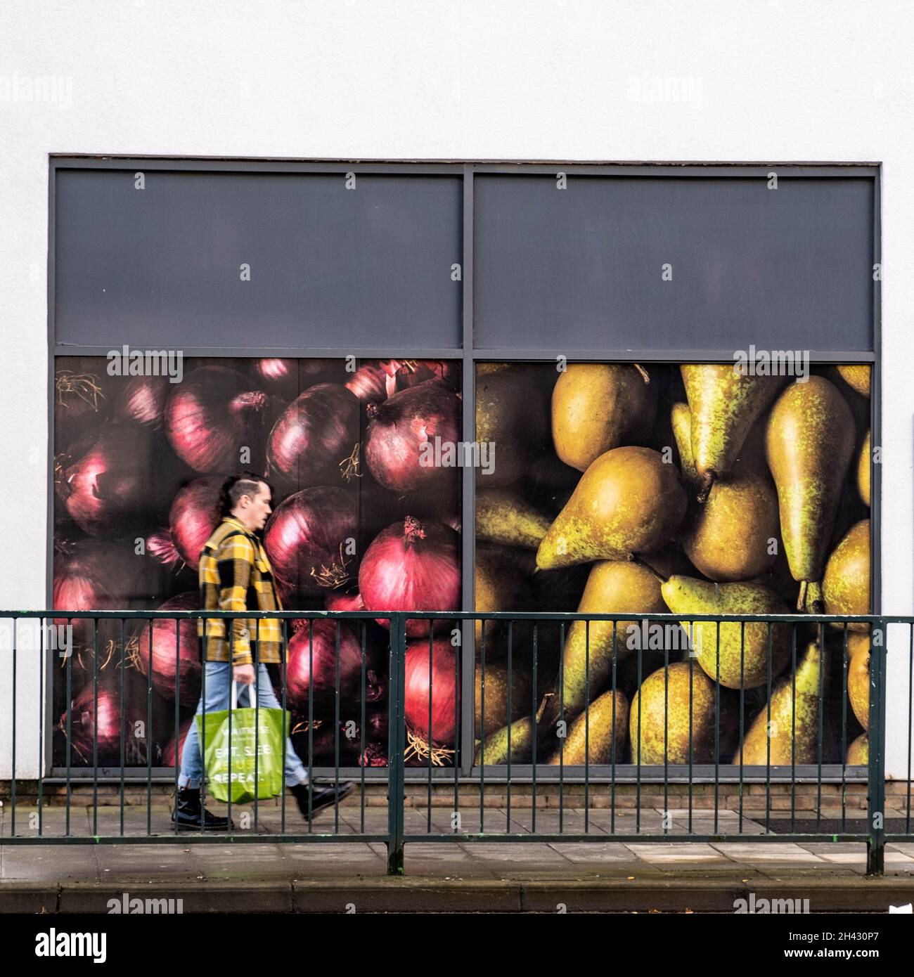 Epsom Surrey London UK, October 31 2021, One Man Walking Past A Co-Op Supermarket Advertising Board Carry Shopping Stock Photo