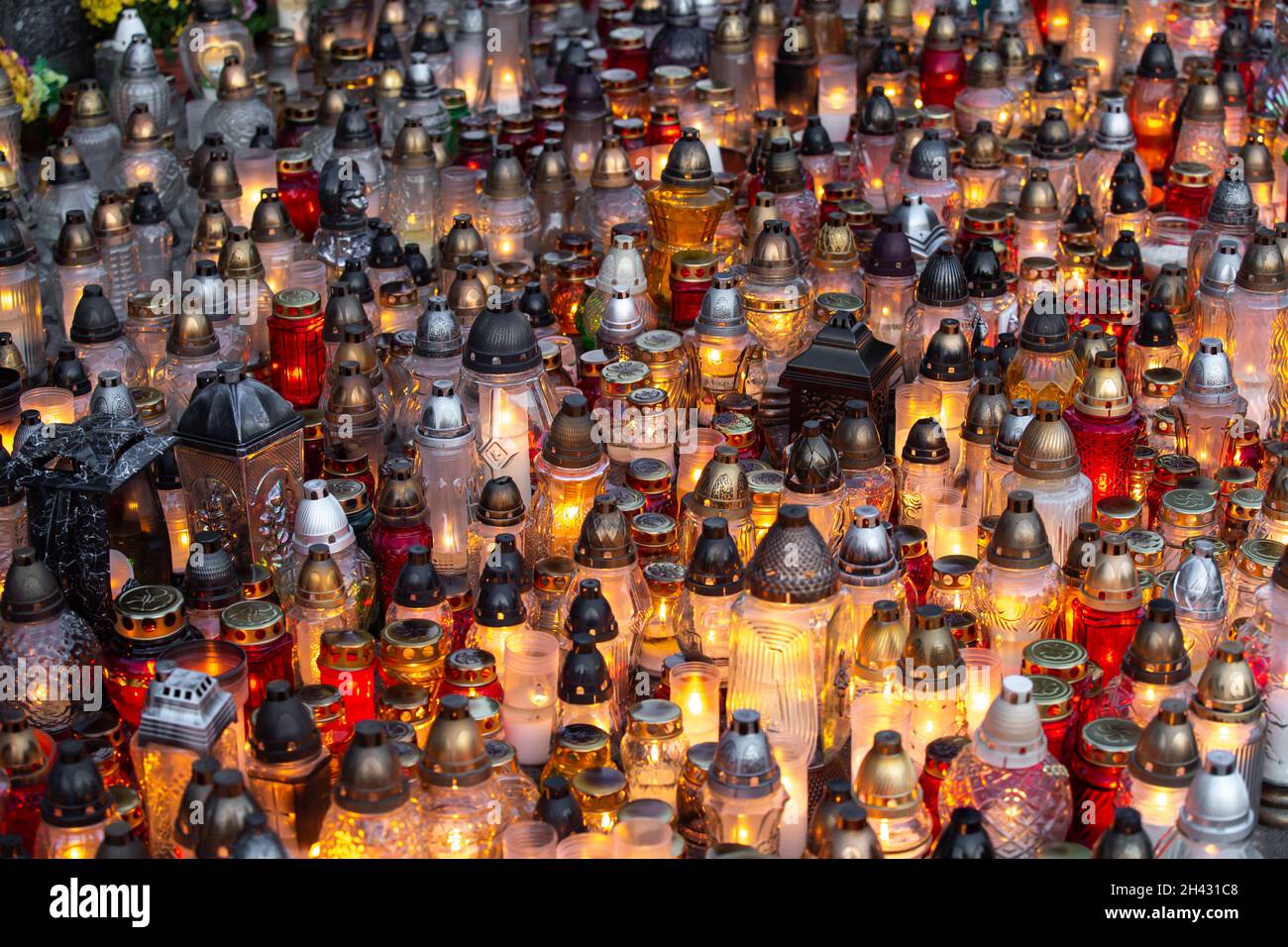 Candles burning at a cemetery during the All Saints Day Stock Photo