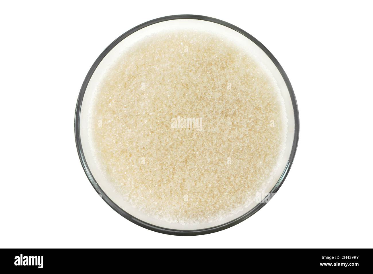 Bowl, plate with free-flowing sugar close-up on a white background. Granulated Sugar Isolate Stock Photo