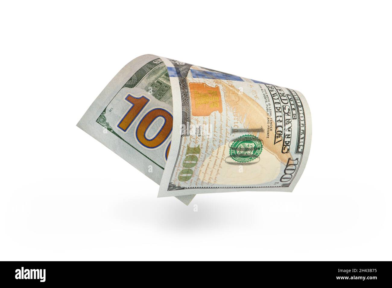 Hundred dollar bill falling casting shadow, half-folded bill close-up ...