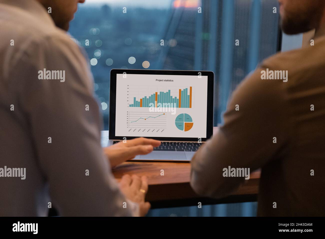 Close up focus on laptop screen with project statistics. Stock Photo