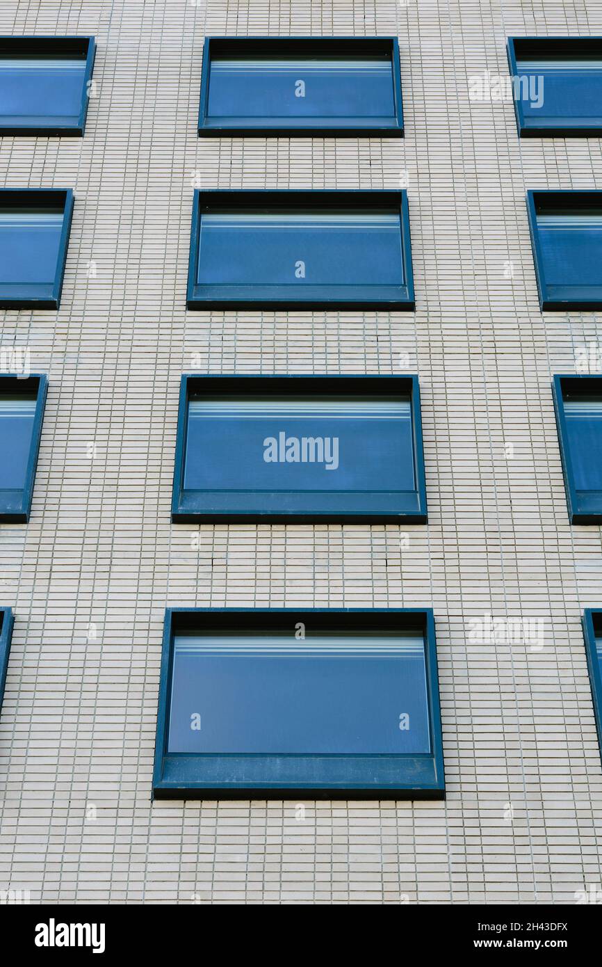 Grid of hotel room windows on the South facade. Radisson RED Rosebank
