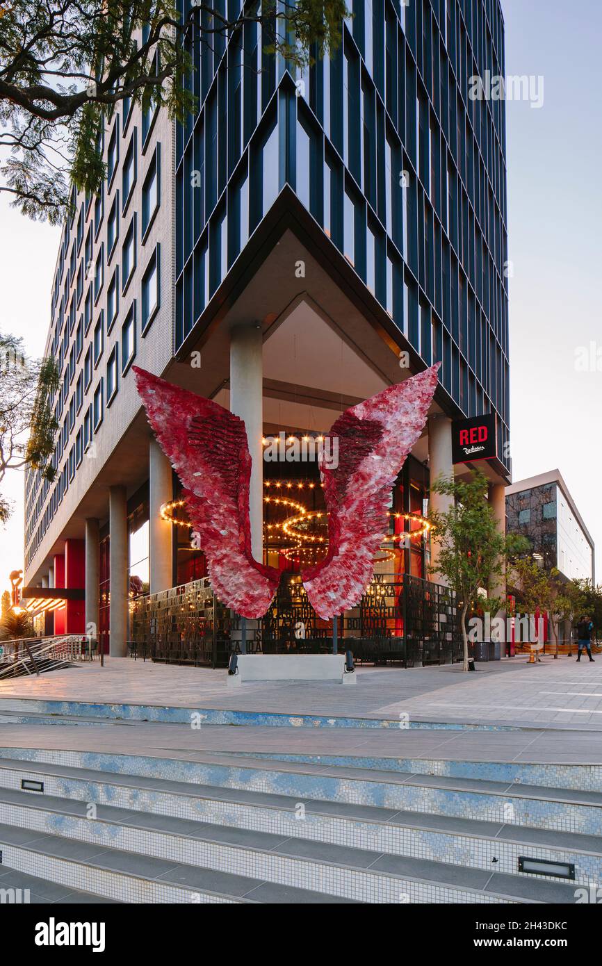 Approach to the hotel and art installation up the mosaic stairs from