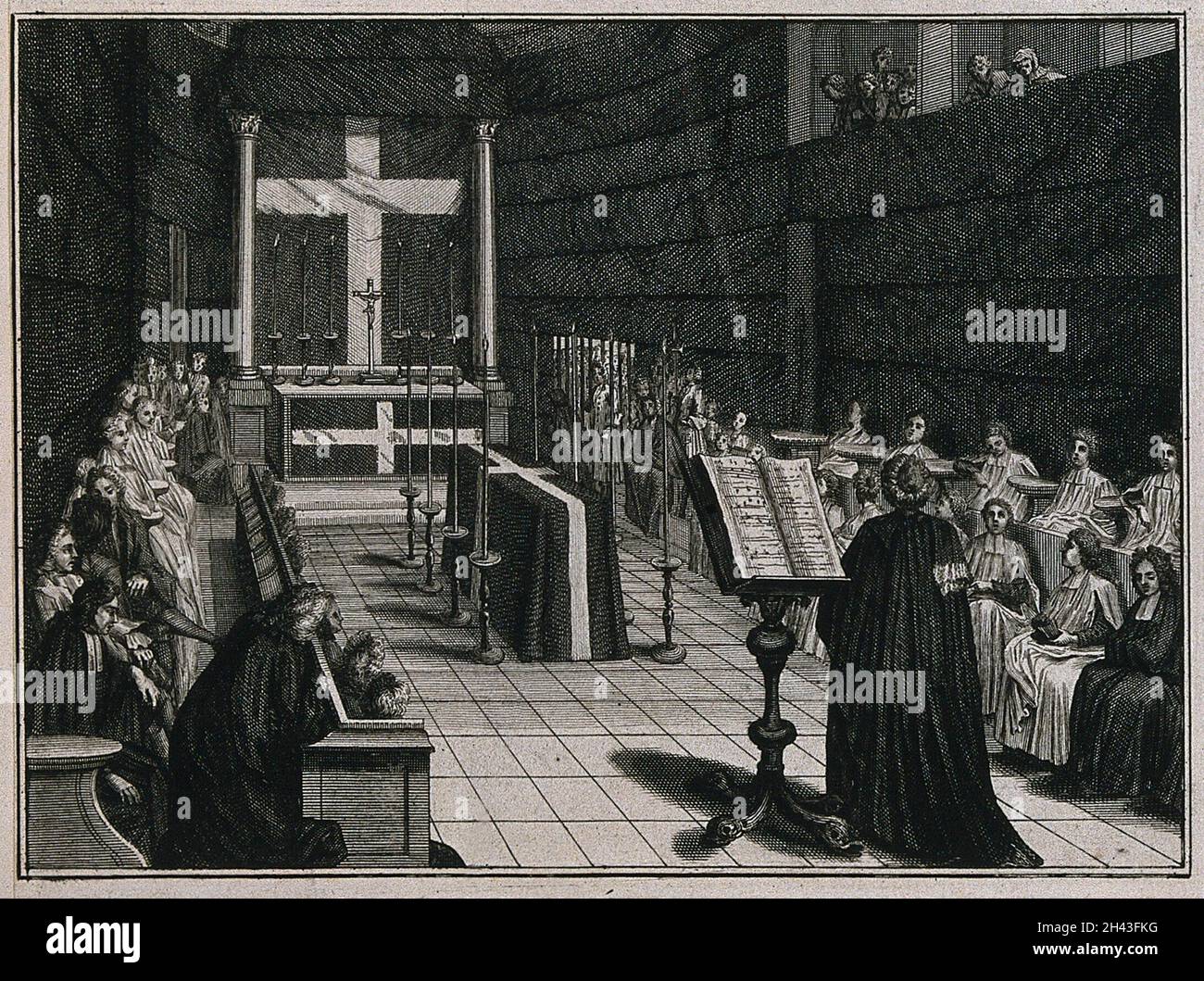 A coffin layed out on a bier in a chapel surrounded by a choir. Etching by B. Picart, 1724. Stock Photo