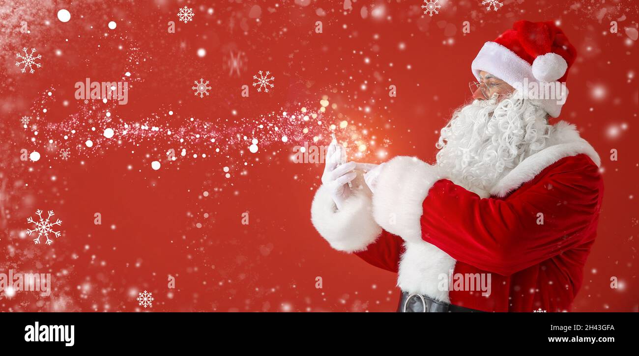 Portrait of Santa Claus with mobile phone on color background with space  for text Stock Photo - Alamy